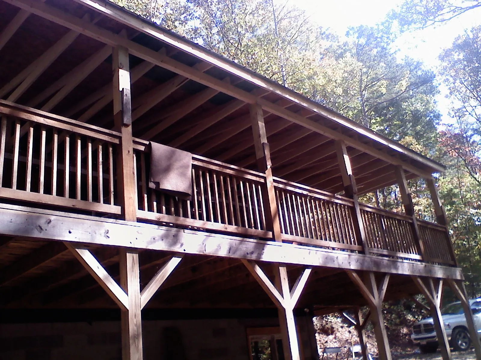 Timber framing under a new elevated porch and deck — Roof Leak Repair in Grainfield by Roofing Brothers